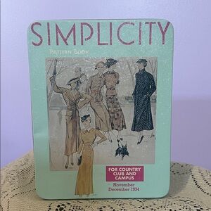 Simplicity Mint Green Tin with Pink Logo and Illustrated Dress Art